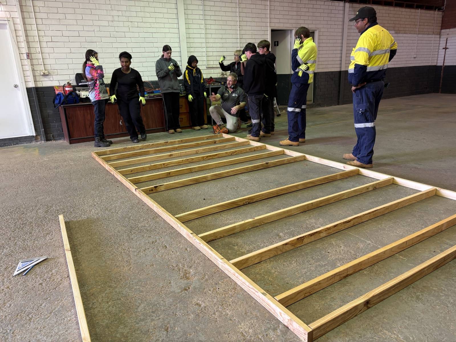 Students learning about timber frame construction