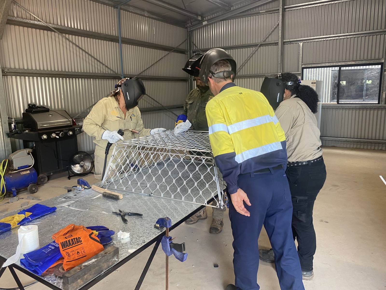 Trainer Assessor Rudi inspecting the students welding progress